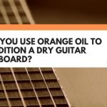 orange oil guitar fretboard